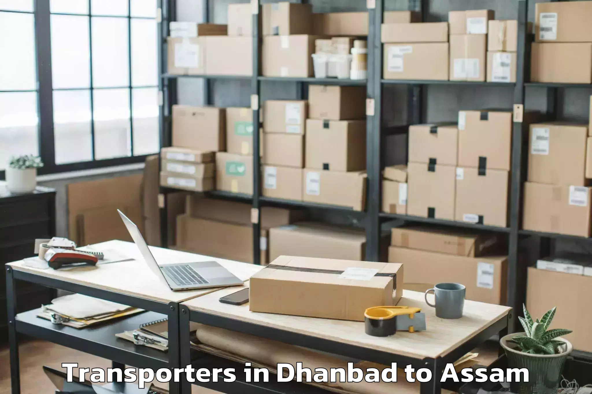 Top Dhanbad to Barpeta Road Transporters Available